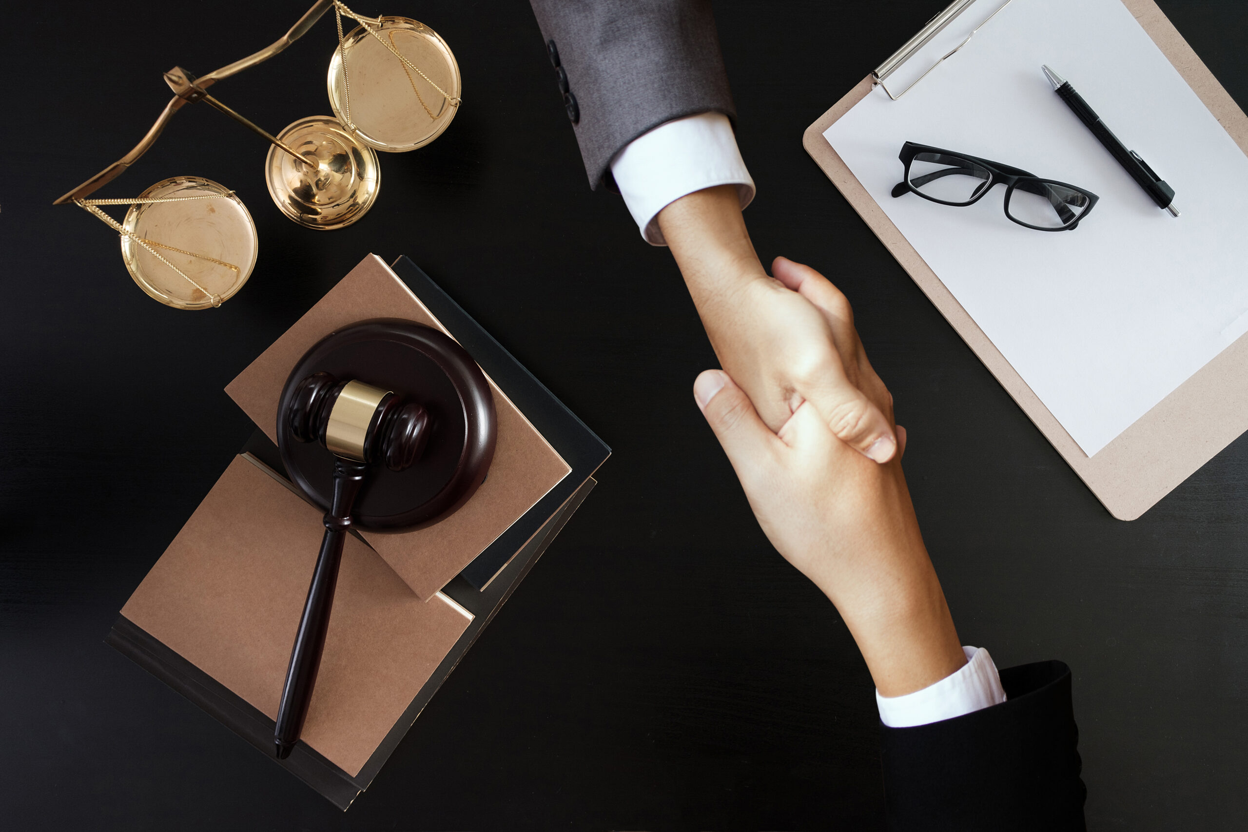 Businessman shaking  discussing a contract agreement Lawyer from