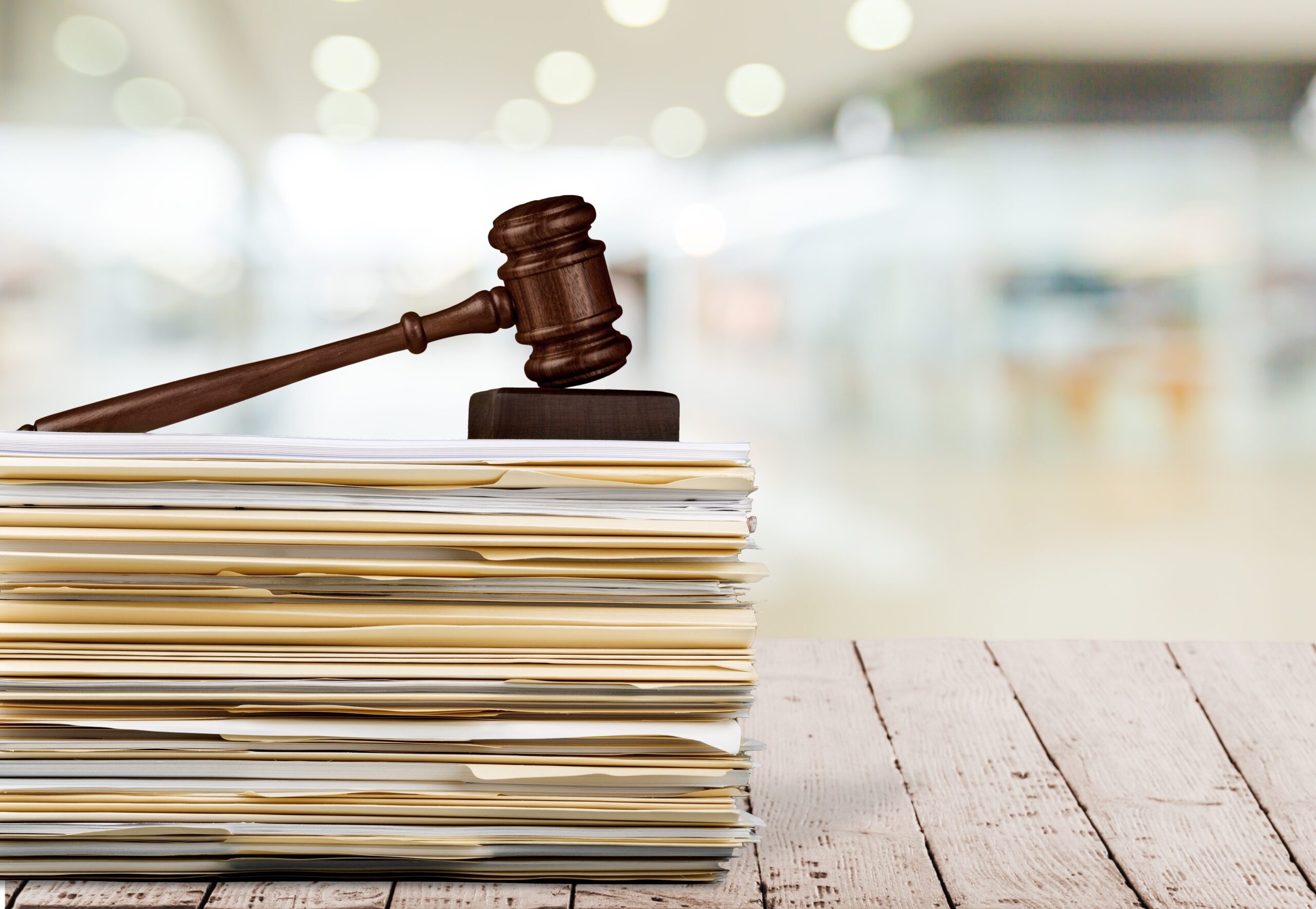 Judge hammer and documents on  background